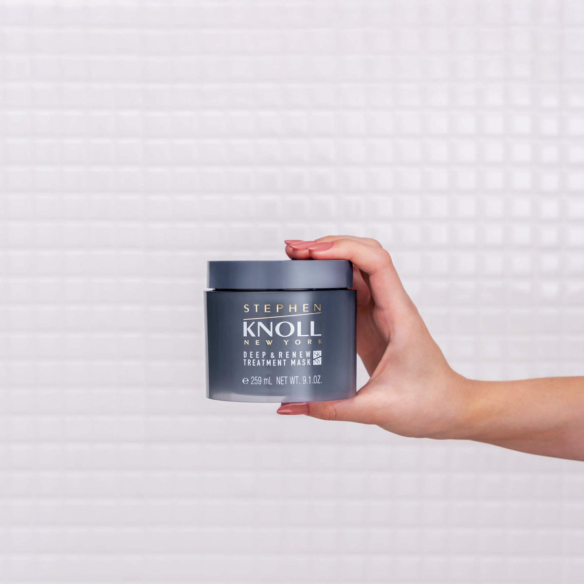 Stephen Knoll Deep & Renew Treatment Mask jar held in hand, front view