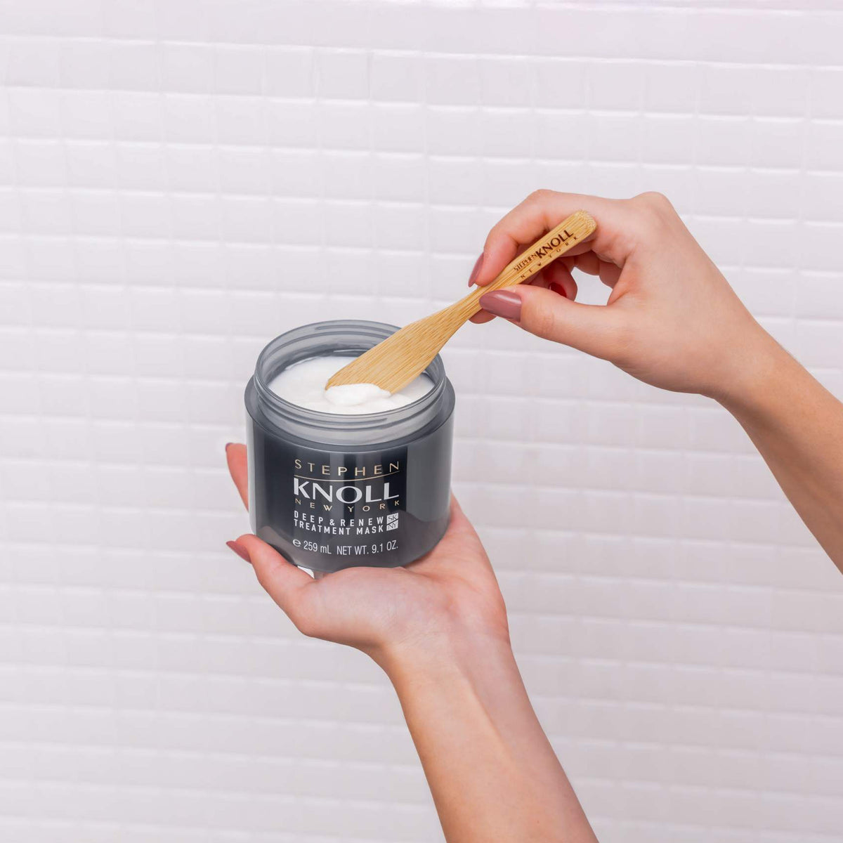 Stephen Knoll Deep & Renew Treatment Mask jar held in hand