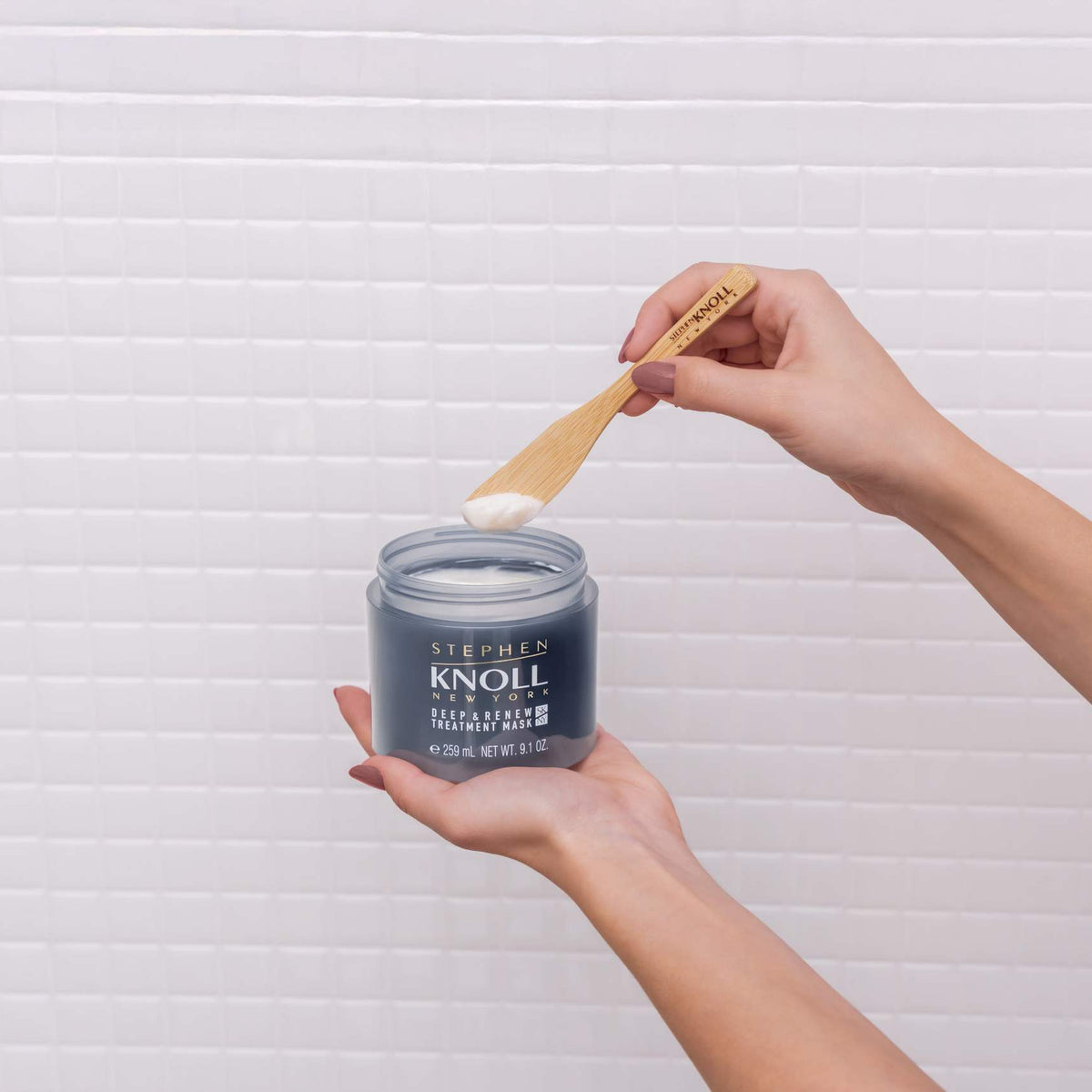 Stephen Knoll Deep & Renew Treatment Mask jar held in hand